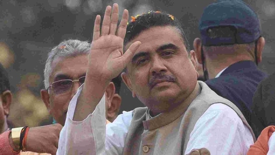 BJP leader Suvendu Adhikari gestures during a roadshow from Tollygunge to Rashbehari in Kolkata, West Bengal( Samir Jana / Hindustan Times) BJP leader Suvendu Adhikari gestures during a roadshow from Tollygunge to Rashbehari in Kolkata, West Bengal( Samir Jana / Hindustan Times)