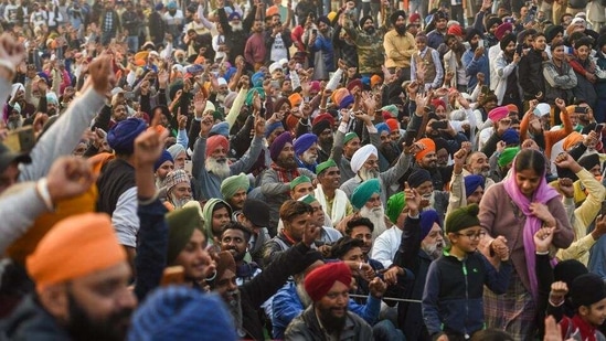 Farmers raise slogans during a protest against the new farm laws at Delhi-UP Ghazipur border in New Delhi. (PTI)(HT_PRINT) Farmers raise slogans during a protest against the new farm laws at Delhi-UP Ghazipur border in New Delhi. (PTI)(HT_PRINT)