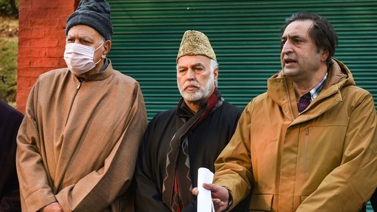 File photo of former spokesperson of Peoples Alliance for Gupkar Declaration (PAGD) Sajad Lone (right) addressing media persons in Srinagar as PAGD President Farooq Abdullah (L) looks on. (PTI)