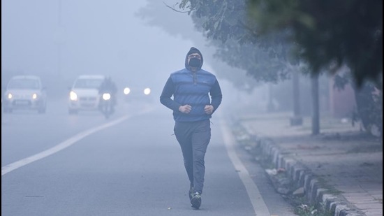 A man jogs on a foggy morning at Pusa Road in New Delhi. (Sanchit Khanna/HT PHOTO) A man jogs on a foggy morning at Pusa Road in New Delhi. (Sanchit Khanna/HT PHOTO)
