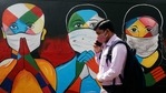 A man walks past graffiti of people wearing protective masks amidst the spread of the coronavirus disease (Covid-19) on a street in Navi Mumbai, on January 21. India recorded 15,223 new cases of the coronavirus disease (Covid-19) in the last 24 hours, according to Union health ministry update. With this, the nationwide tally reached 10,610,883. A man walks past graffiti of people wearing protective masks amidst the spread of the coronavirus disease (Covid-19) on a street in Navi Mumbai, on January 21. India recorded 15,223 new cases of the coronavirus disease (Covid-19) in the last 24 hours, according to Union health ministry update. With this, the nationwide tally reached 10,610,883.