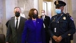 Vice President Kamala Harris, center, followed by her husband Doug Emhoff, left, leaves the Senate chamber after swearing in.(AP Photo ) Vice President Kamala Harris, center, followed by her husband Doug Emhoff, left, leaves the Senate chamber after swearing in.(AP Photo )