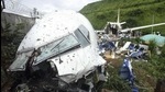 People stand by the debris of the Air India Express flight that skidded off a runway while landing in Kozhikode, Kerala, in August 2020. The special evacuation flight bringing people home to India who had been trapped abroad because of the coronavirus skidded off the runway and split in two while landing in heavy rain killing more than a dozen people and injuring dozens more. (AP) People stand by the debris of the Air India Express flight that skidded off a runway while landing in Kozhikode, Kerala, in August 2020. The special evacuation flight bringing people home to India who had been trapped abroad because of the coronavirus skidded off the runway and split in two while landing in heavy rain killing more than a dozen people and injuring dozens more. (AP)