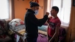 Valeriu Nicolae shows a boy how to correctly brush his teeth in Nucsoara, Romania, Saturday, Jan. 9, 2021. A gentle hero to many in Romania, Valeriu Nicolae says that, at heart, he is more like former NBA star Michael Jordan — highly competitive and eager to improve in what he does best. In Nicolae’s case that is helping others. The rights activist has earned praise for his tireless campaign to change for the better the lives of the Balkan country’s poorest and underprivileged residents, particularly the children. (AP Photo/Andreea Alexandru)(AP) Valeriu Nicolae shows a boy how to correctly brush his teeth in Nucsoara, Romania, Saturday, Jan. 9, 2021. A gentle hero to many in Romania, Valeriu Nicolae says that, at heart, he is more like former NBA star Michael Jordan — highly competitive and eager to improve in what he does best. In Nicolae’s case that is helping others. The rights activist has earned praise for his tireless campaign to change for the better the lives of the Balkan country’s poorest and underprivileged residents, particularly the children. (AP Photo/Andreea Alexandru)(AP)