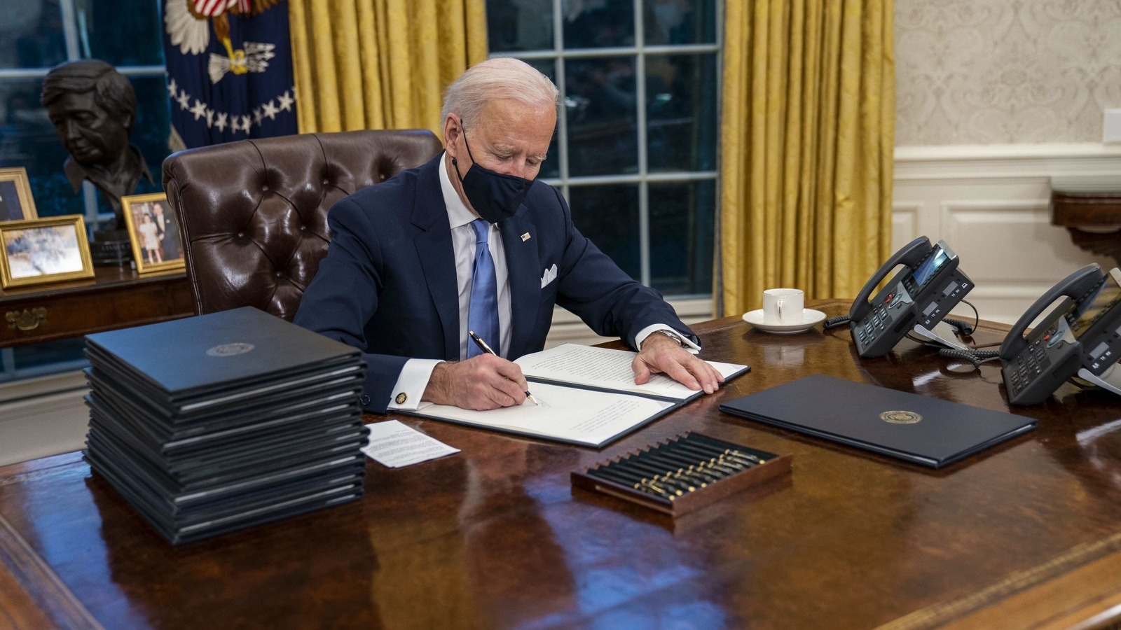 On Day 1, Joe Biden sets the ball rolling on immigration, climate change, Covid-19