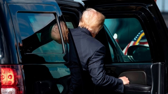 Outgoing US President Donald Trump steps into his limo after landing at Palm Beach International Airport in West Palm Beach, Florida, on January 20, 2021. (AFP)