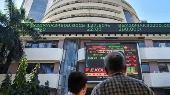 People watch the Sensex on a screen outside Bombay Stock Exchange (BSE) in Mumbai. (PTI File Photo) People watch the Sensex on a screen outside Bombay Stock Exchange (BSE) in Mumbai. (PTI File Photo)