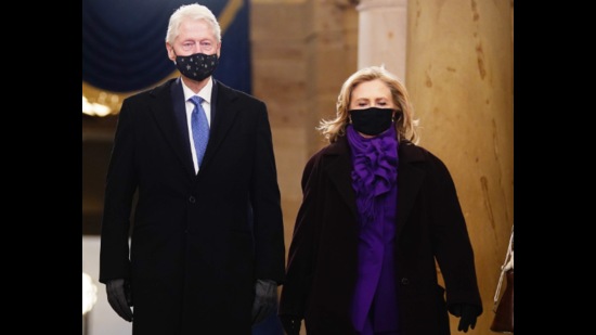 Hillary Clinton donned a bright purple suit and matching scarf, which she paired with a dark wool coat to keep warm (Photo: Agencies) Hillary Clinton donned a bright purple suit and matching scarf, which she paired with a dark wool coat to keep warm (Photo: Agencies)