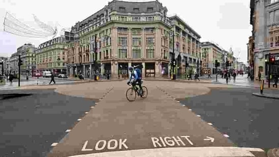 A cyclist rides across an empty Oxford Street in London as Britain heads into a national lockdown on January 5. British Prime Minister Boris Johnson on January 4 ordered England into a new national lockdown to contain a surge in Covid-19 cases that was threatening the British healthcare system before a vaccine programme reached a critical mass. (Justin Tallis / AFP) A cyclist rides across an empty Oxford Street in London as Britain heads into a national lockdown on January 5. British Prime Minister Boris Johnson on January 4 ordered England into a new national lockdown to contain a surge in Covid-19 cases that was threatening the British healthcare system before a vaccine programme reached a critical mass. (Justin Tallis / AFP)