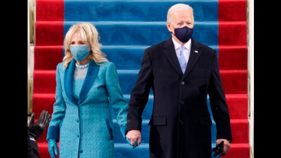 Dr Jill Biden opted for a Markarian ensemble consisting of a tapered dress with a chiffon bodice and scalloped skirt; (right) President Joe Biden was formally dressed. (Photo: Agencies) Dr Jill Biden opted for a Markarian ensemble consisting of a tapered dress with a chiffon bodice and scalloped skirt; (right) President Joe Biden was formally dressed. (Photo: Agencies)