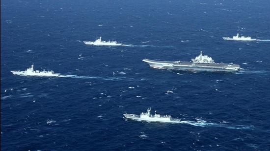 File photo of a Chinese Navy formation, including the aircraft carrier Liaoning (centre), during military drills in the South China Sea. (AFP file)