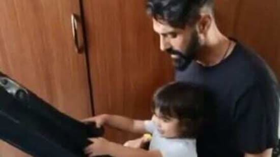 Arjun Rampal and his son, Arik, in a new video shared on social media. 