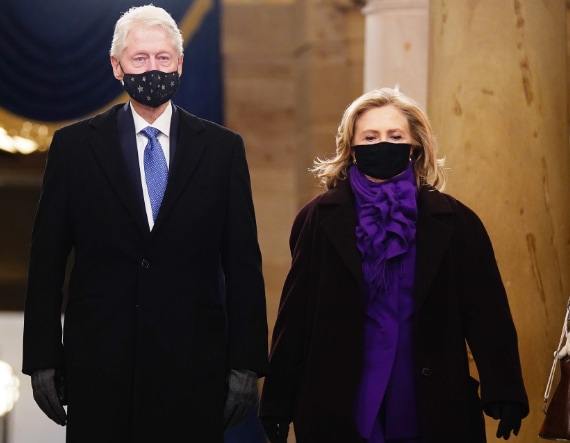 Hillary Clinton donned a bright purple suit and matching scarf, which she paired with a dark wool coat to keep warm (Photo: Agencies)