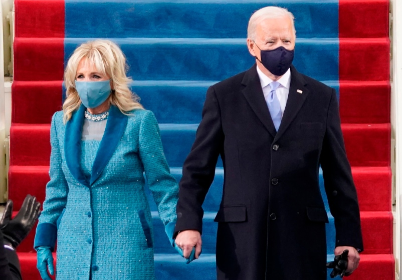 Dr Jill Biden opted for a Markarian ensemble consisting of a tapered dress with a chiffon bodice and scalloped skirt; (right) President Joe Biden was formally dressed. (Photo: Agencies)