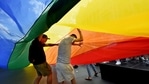 People walk under the giant rainbow flag in front of the parliament building in Budapest downtown during the lesbian, gay, bisexual and transgender (LGBT) Pride Parade in the Hungarian capital. (AFP) People walk under the giant rainbow flag in front of the parliament building in Budapest downtown during the lesbian, gay, bisexual and transgender (LGBT) Pride Parade in the Hungarian capital. (AFP)