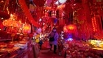 A vendor wearing a mask to protect from the coronavirus walks through her store of Chinese New Year decorations in Wuhan in central China's Hubei province on Friday, Jan. 22, 2021. Life appears to be back to normal on the eve of the anniversary of the 76-day lockdown in the central Chinese city where the coronavirus was first detected. (AP) A vendor wearing a mask to protect from the coronavirus walks through her store of Chinese New Year decorations in Wuhan in central China's Hubei province on Friday, Jan. 22, 2021. Life appears to be back to normal on the eve of the anniversary of the 76-day lockdown in the central Chinese city where the coronavirus was first detected. (AP)