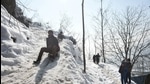 Youngsters enjoy the snow on a hilltop after heavy snowfall, on the outskirts of Srinagar on January 19. (File photo) Youngsters enjoy the snow on a hilltop after heavy snowfall, on the outskirts of Srinagar on January 19. (File photo)