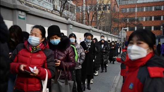 People line up to be tested for the Covid-19 coronavirus in Beijing on January 22. (AFP) People line up to be tested for the Covid-19 coronavirus in Beijing on January 22. (AFP)