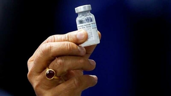 Union health minister Dr Harsh Vardhan showing a bottle of Covaxin dose at AIIMS in New Delhi.(REUTERS)