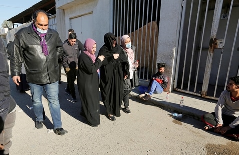 bombing twin baghdad iraq kindi mourn suicide morgue attack hospital walk outside central following al they reuters market