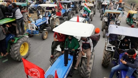 Farmers participate in a tractor rally to protest against the newly passed farm bills, on a highway on the outskirts of New Delhi, India, January 7, 2021. (Reuters)
