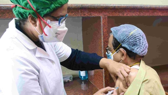 A nurse administers the COVID-19 vaccine to a frontline worker during a vaccination drive in Kolkata. (ANI PHOTO). A nurse administers the COVID-19 vaccine to a frontline worker during a vaccination drive in Kolkata. (ANI PHOTO).