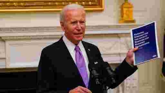President Joe Biden holds a booklet as he speaks about the coronavirus in the State Dinning Room of the White House, Thursday, Jan. 21, 2021, in Washington. (AP Photo/Alex Brandon)(AP) President Joe Biden holds a booklet as he speaks about the coronavirus in the State Dinning Room of the White House, Thursday, Jan. 21, 2021, in Washington. (AP Photo/Alex Brandon)(AP)