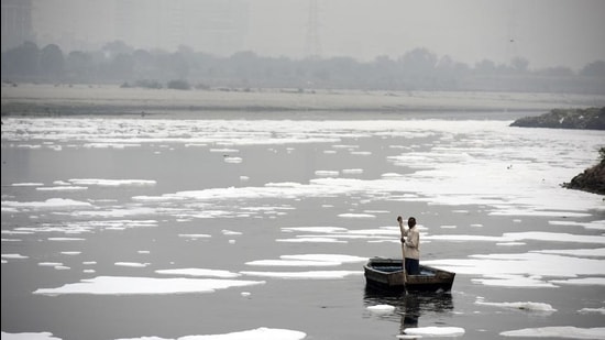 Representational image. A man rows a boat in the heavily polluted waters of the Yamuna River. (Biplov Bhuyan/HT PHOTO) Representational image. A man rows a boat in the heavily polluted waters of the Yamuna River. (Biplov Bhuyan/HT PHOTO)