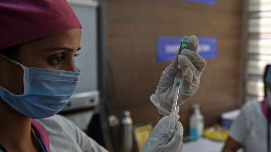 A medical worker fills a syringe with Covishield, AstraZeneca-Oxford's Covid-19 coronavirus vaccine made by Serum Institute of India, at a hospital in Ahmedabad. (AFP) A medical worker fills a syringe with Covishield, AstraZeneca-Oxford's Covid-19 coronavirus vaccine made by Serum Institute of India, at a hospital in Ahmedabad. (AFP)