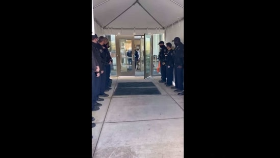 The image shows the cops welcoming Arlo.(Facebook/@Thurston County-Sheriff)