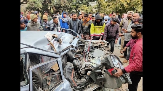 The mangled remains of the car after the accident on the Talwara-Hajipur road in Mukerian sub division on Friday. (HT Photo)