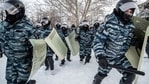 Riot police officers run during a protest against the jailing of opposition leader Alexei Navalny in Yekaterinburg, Russia, Saturday, Jan. 23, 2021. (AP)