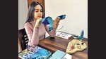 Niharika Rajput at work on a paper sculpture of the Indian Roller. Niharika Rajput at work on a paper sculpture of the Indian Roller.
