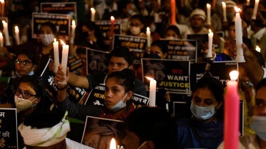 People hold candles during a protest against rising rape incidents at Jantar Mantar in New Delhi. (Biplov Bhuyan/ Hindustan Times)