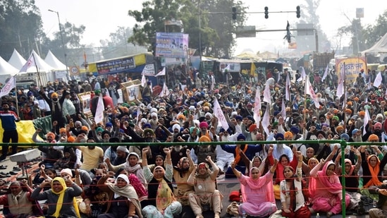 Farmers raise slogans during an ongoing protest against the new farm laws, at the Singhu border in New Delhi. Farmers raise slogans during an ongoing protest against the new farm laws, at the Singhu border in New Delhi.