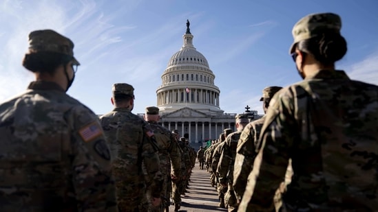 Members of the National Guard march towards the US Capitol in Washington, DC(Bloomberg) Members of the National Guard march towards the US Capitol in Washington, DC(Bloomberg)