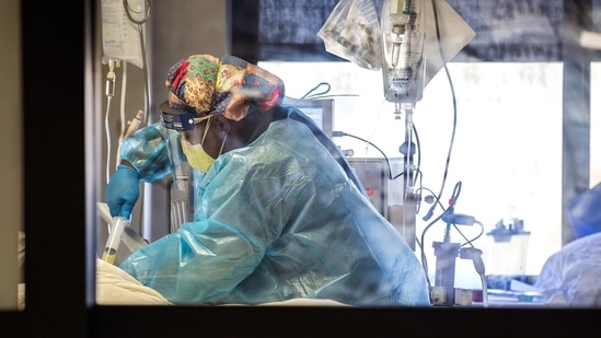 Registered Nurse Khadija Finger cares for an intubated patient in the coronavirus intensive care unit at Christus Santa Rosa Hospital in New Braunfels, Texas,(AP) Registered Nurse Khadija Finger cares for an intubated patient in the coronavirus intensive care unit at Christus Santa Rosa Hospital in New Braunfels, Texas,(AP)