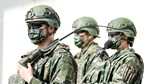 Members of Taiwan's armed forces wear protective masks during a military exercise in Hukou, Hsinchu County, Taiwan, on Tuesday, Jan. 19, 2021. China's state-run media called for retaliation after the Trump administration removed decades-old restrictions on interactions with Taiwan officials just days before President-elect Joe Biden takes office, one of its biggest moves yet to reshape U.S. ties with the Asian democracy. Photographer: I-Hwa Cheng/Bloomberg(Bloomberg) Members of Taiwan's armed forces wear protective masks during a military exercise in Hukou, Hsinchu County, Taiwan, on Tuesday, Jan. 19, 2021. China's state-run media called for retaliation after the Trump administration removed decades-old restrictions on interactions with Taiwan officials just days before President-elect Joe Biden takes office, one of its biggest moves yet to reshape U.S. ties with the Asian democracy. Photographer: I-Hwa Cheng/Bloomberg(Bloomberg)