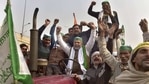 BKU spokesperson Rakesh Tikait along with farmers raises slogans during their ongoing agitation against Centre's farm reform laws at Ghazipur border,(PTI) BKU spokesperson Rakesh Tikait along with farmers raises slogans during their ongoing agitation against Centre's farm reform laws at Ghazipur border,(PTI)
