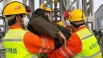 In this photo released by Xinhua News Agency, rescuers carry a miner who was trapped in a gold mine in Qixia City in east China's Shandong Province,(AP) In this photo released by Xinhua News Agency, rescuers carry a miner who was trapped in a gold mine in Qixia City in east China's Shandong Province,(AP)