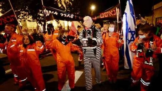 Israeli protesters chant slogans during a demonstration against Israeli Prime Minister Benjamin Netanyahu In Jerusalem, (AP) Israeli protesters chant slogans during a demonstration against Israeli Prime Minister Benjamin Netanyahu In Jerusalem, (AP)