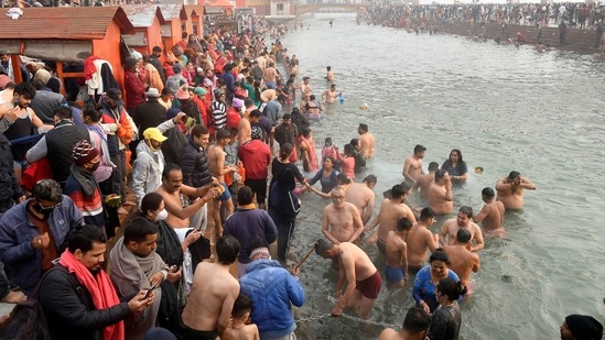 Devotees take a holy dip in the waters of river Ganges to mark "Makar Sankranti" festival.(REUTERS)