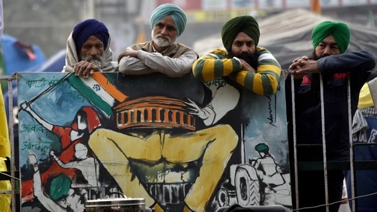 Farmers sitting in a tractor trolly during their protest against farm law, at Singhu Border in New Delhi on Sunday. (ANI Photo) Farmers sitting in a tractor trolly during their protest against farm law, at Singhu Border in New Delhi on Sunday. (ANI Photo)
