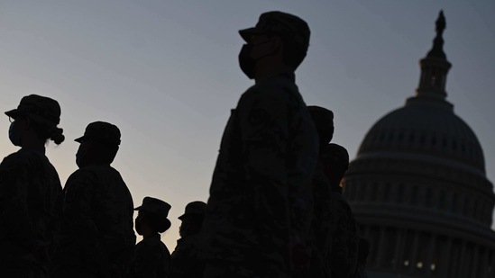 Hundreds of National Guard members are camped out at the Capitol to protect lawmakers, some still reeling from the violence and preparing for Biden's inauguration next week.(AFP) Hundreds of National Guard members are camped out at the Capitol to protect lawmakers, some still reeling from the violence and preparing for Biden's inauguration next week.(AFP)
