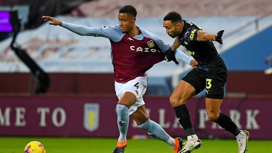 Aston Villa's Ezri Konsa, left, holds off Newcastle's Callum Wilson.(AP) Aston Villa's Ezri Konsa, left, holds off Newcastle's Callum Wilson.(AP)