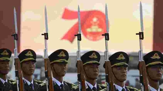 Members of a Chinese military honour guard stand at attention during a rehearsal before the parade in Beijing. In his speech, Xi said China “must adhere” to the one country, two systems policy governing Hong Kong and “maintain the long-term prosperity and stability” of the city. (Mark Schiefelbein / AP) Members of a Chinese military honour guard stand at attention during a rehearsal before the parade in Beijing. In his speech, Xi said China “must adhere” to the one country, two systems policy governing Hong Kong and “maintain the long-term prosperity and stability” of the city. (Mark Schiefelbein / AP)