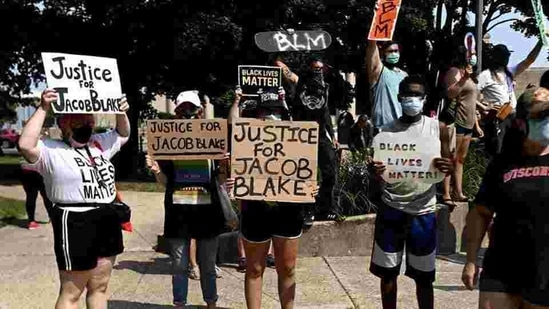Kenosha was in the throes of several nights of chaotic street demonstrations after a white officer shot Blake in the back during a domestic disturbance, leaving Blake paralyzed.(Reuters Photo) Kenosha was in the throes of several nights of chaotic street demonstrations after a white officer shot Blake in the back during a domestic disturbance, leaving Blake paralyzed.(Reuters Photo)
