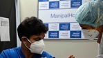 A medical worker (R) inoculates a medical staff with a Covid-19 coronavirus vaccine at the Manipal Hospital, in New Delhi. (Photo by Money SHARMA / AFP)(AFP) A medical worker (R) inoculates a medical staff with a Covid-19 coronavirus vaccine at the Manipal Hospital, in New Delhi. (Photo by Money SHARMA / AFP)(AFP)