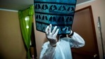 A doctor checks an x-ray of a Covid-19 patient at a home in Lima, Peru on January 22. Global cases of Covid-19 infection are moving towards the 100 million milestone --a little over a year since the alert was raised by the World Health Organization (WHO) against a novel coronavirus originating in Wuhan, China. A doctor checks an x-ray of a Covid-19 patient at a home in Lima, Peru on January 22. Global cases of Covid-19 infection are moving towards the 100 million milestone --a little over a year since the alert was raised by the World Health Organization (WHO) against a novel coronavirus originating in Wuhan, China.