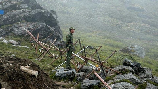 A Chinese soldier stands guard on the Chinese side of the Naku La border crossing between India and China.(AFP File) A Chinese soldier stands guard on the Chinese side of the Naku La border crossing between India and China.(AFP File)